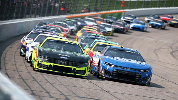 Ryan Blaney, driver of the #12 Menards/Pennington Ford, and Kyle Larson, driver of the #5 HendrickCars.com Chevrolet, race during the NASCAR Cup Series Iowa Corn 350 Powered by Ethanol at Iowa Speedway on August 09, 2026 in Newton, Iowa.